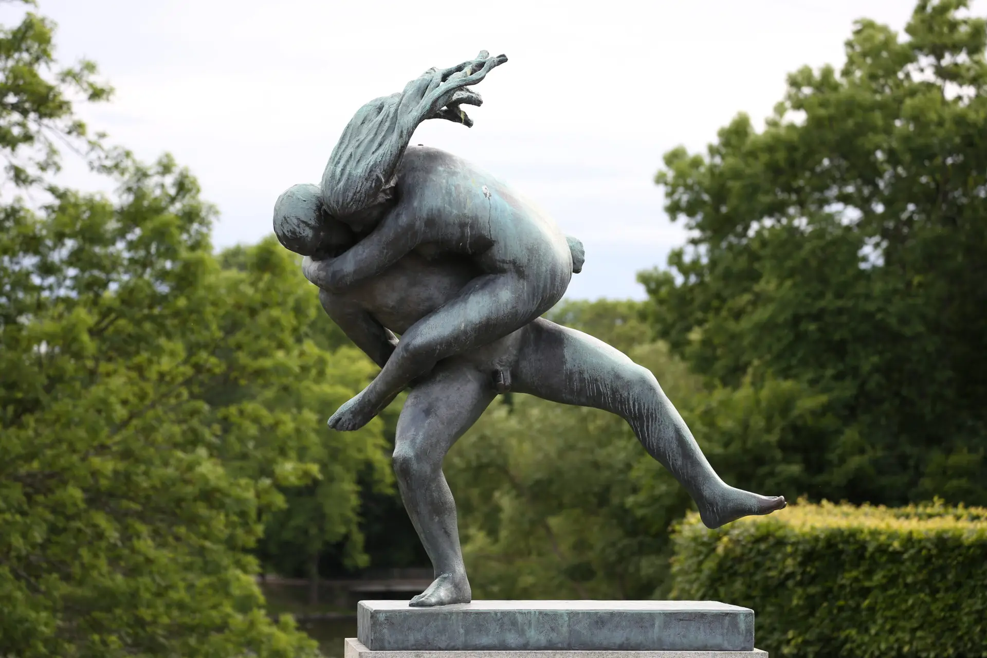 Vigeland Park sculpture — two figures intertwined inside a granite ring